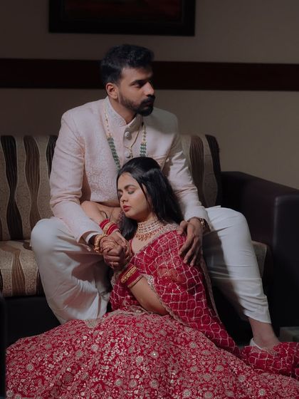 An artistic and romantic photo of the couple. Dr. Meghana's makeup looks flawless even in this moody, intimate shot.