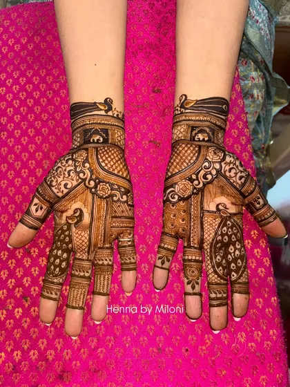 This intricate design combines classic peacock figures with detailed geometric and floral patterns. The symmetry and clean lines are a signature of my bridal work.