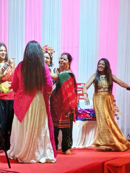 A moment of pure joy on stage during a Navratri celebration. Dancing with the prize winners and celebrating their energy is one of the best parts of my job.