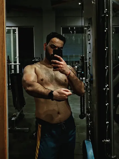 Capturing the results at the end of a bulking season. This phase is all about strategic eating and heavy lifting to build a solid foundation of muscle mass.