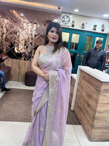 A full-length shot of the client in the elegant lavender saree, looking poised and ready for her event.