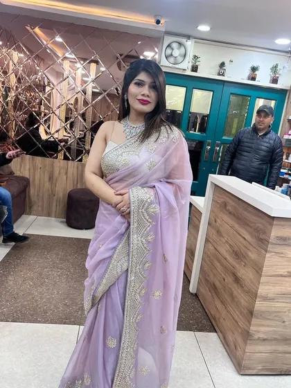 A full-length shot of the client in the elegant lavender saree, looking poised and ready for her event.