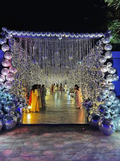 A closer look at the spectacular disco ball entrance tunnel, a perfect Instagram moment for guests.