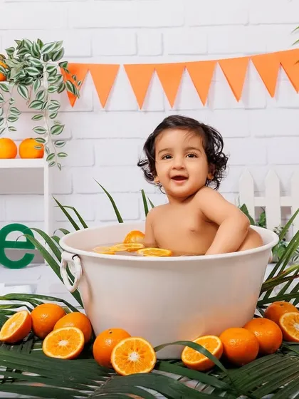 A full setup of the orange-themed tub splash, showing the happy baby and all the fun details.