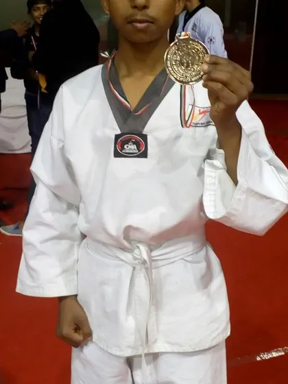 Another one of our champions with his well-deserved gold medal.