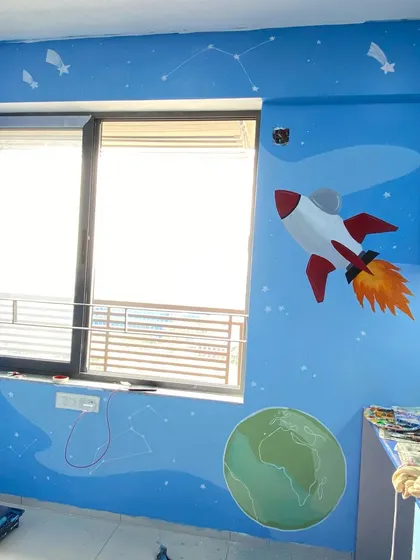 This rocket and Earth mural was for a little boy's room. His parents wanted to inspire him to dream big, and we think a custom ISRO-themed rocket blasting off into space is a great way to do that.