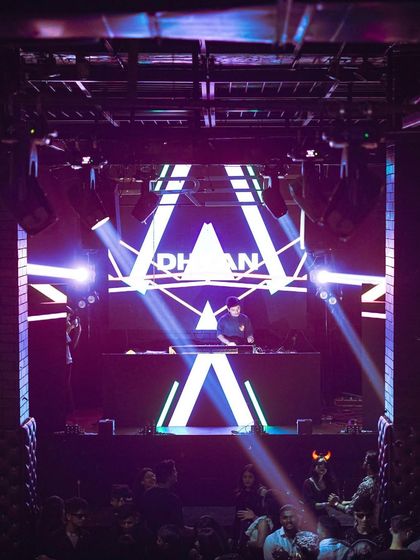 Nothing helps me express myself better than music. The stage setup with my name in lights creates a powerful presence.