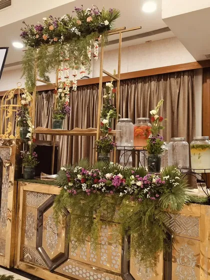 I offer beautifully designed beverage counters, including this rustic-themed detox water station, perfect for adding a healthy and elegant touch to your event.