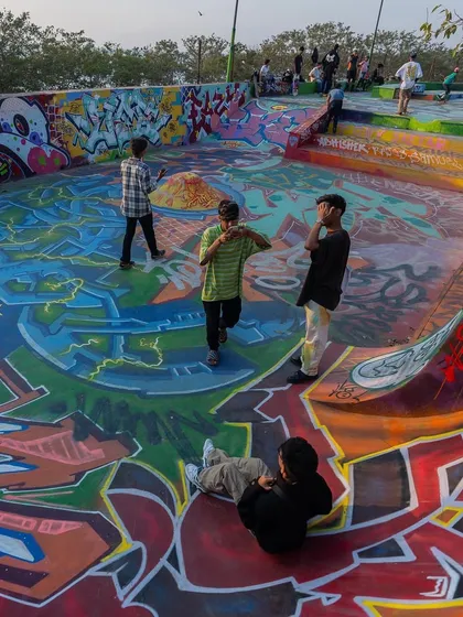 The community hanging out in the finished skate bowl. The project was about creating a space for people, not just a mural.