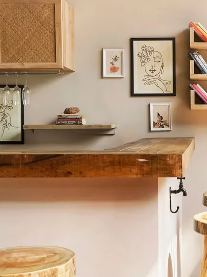 Materiality is central to my work. At Unallome in Goa, the bar is crafted from a thick slab of salvaged wood, preserving its natural texture and history. Paired with simple line art and open shelving, it becomes a focal point that feels both rustic and refined.