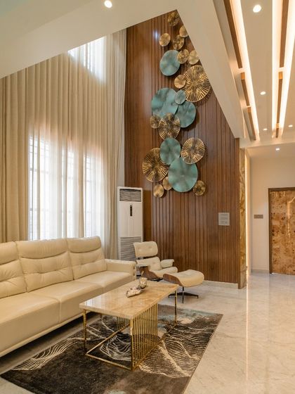 Another angle of the living room, showing the interplay of light, texture, and art.