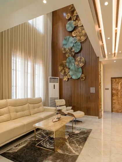 Another angle of the living room, showing the interplay of light, texture, and art.