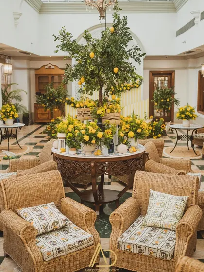 A fresh and vibrant Haldi ceremony setup, bursting with the cheerful energy of sunflowers, lemons, and wicker furniture. This shows how I infuse traditional events with a unique and modern aesthetic.