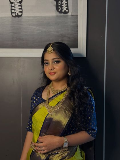 A portrait of the same South Indian bridal look, showcasing the flawless base and how the bold eye makeup is balanced with a softer lip.