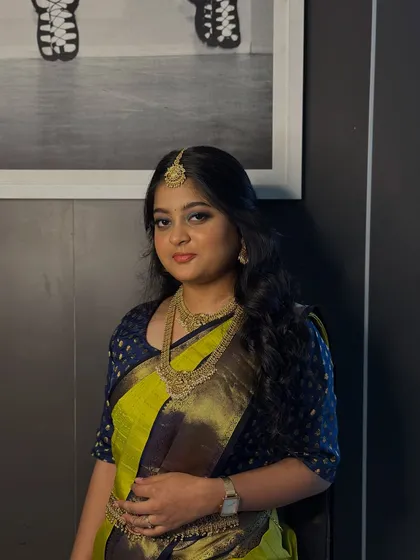A portrait of the same South Indian bridal look, showcasing the flawless base and how the bold eye makeup is balanced with a softer lip.