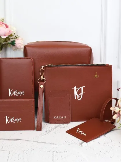 A classic and sophisticated travel combo in brown, personalized with the name "Karan" and the initials "KJ."