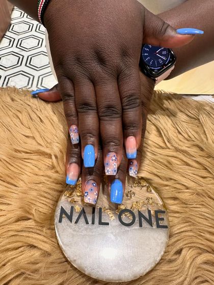 Another angle of the modern blue French manicure, showing how the elements work together to create a unique and beautiful set.