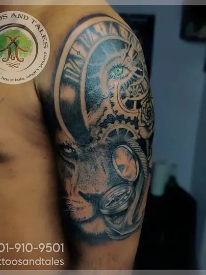 This is a freehand cover-up tattoo. We transformed an old piece into a new design featuring a lion, clock, and compass, combining different elements to create a completely fresh and meaningful sleeve.