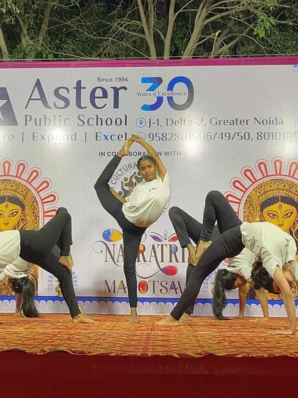 A complex group acroyoga formation, creating a human centerpiece that demonstrates trust, balance, and teamwork.