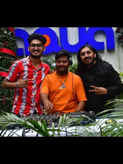 Posing with fellow artists and friends during a Christmas-themed event. Collaboration and brotherhood are important to me.