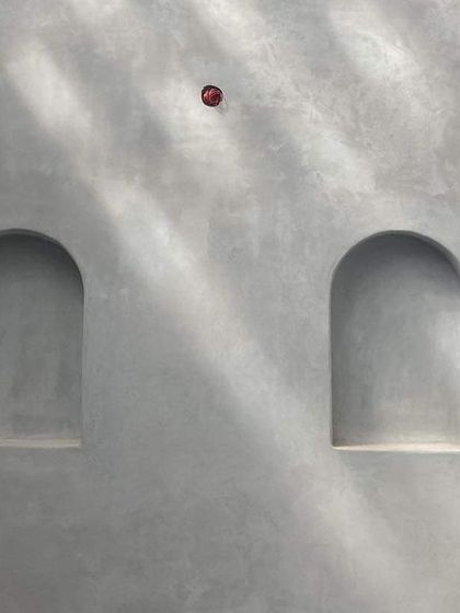 A detail of the lime-plastered walls in an estate villa in Chickmagalur, where the play of light from a water body creates a beautiful, shimmering effect.