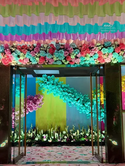 A close-up of the floral garland over the doorway, a beautiful and welcoming detail.