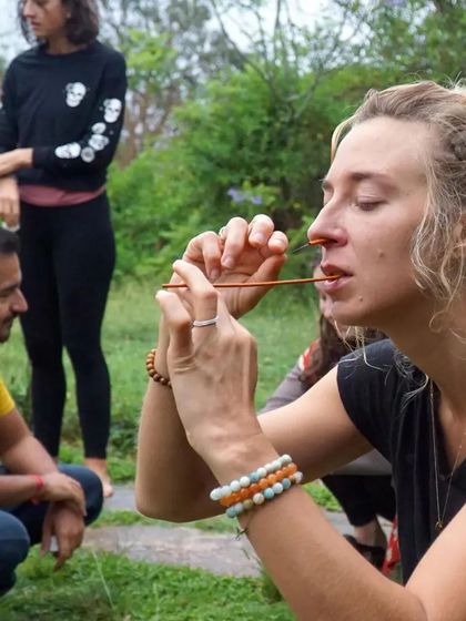 A student practices Sutra Neti, an advanced yogic cleansing technique. This kriya is taught in our 300-hour training to help clear the nasal passages and subtle energy channels, promoting clearer breathing and mental focus.