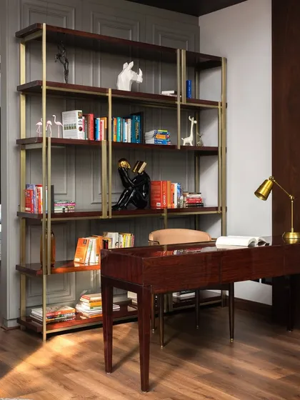 A beautifully styled study space, showcasing how we create functional yet inspiring areas for work and reading. The open bookshelf acts as a partition, defining the study while maintaining a connection to the larger room.