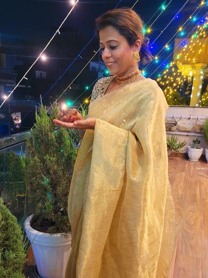 A shot of me celebrating a green Diwali, wearing my repurposed 15-year-old golden tissue saree. Timeless fabrics and colors are always a chic choice.