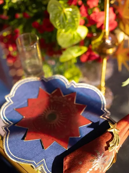 Even the smallest details, like this custom-designed coaster and napkin ring, were created to align with the event's unique theme, ensuring a cohesive and memorable experience.