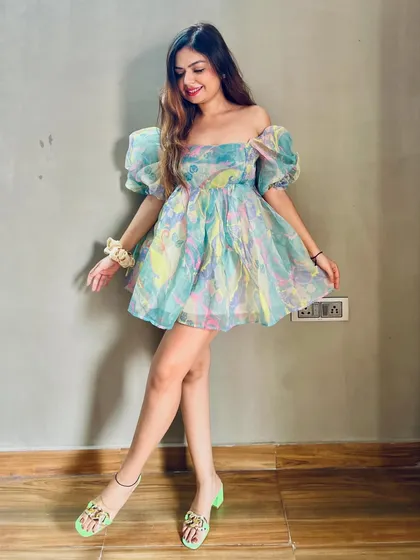 Bringing back the Barbie era with this colorful organza puff-sleeve dress. It's a fun, playful look perfect for summer.