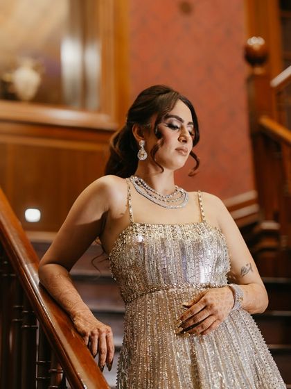 Our client looks stunning in a rented American diamond necklace, perfectly complementing her sequined gown for a reception party.