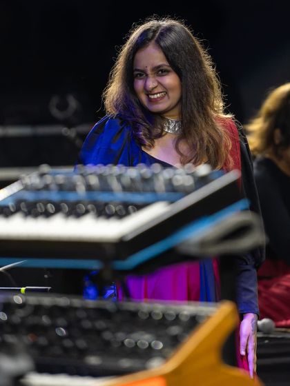 A candid shot from behind the keyboards at Jazz Al Parque. The joy on my face reflects the incredible energy I felt from the audience and my fellow musicians.