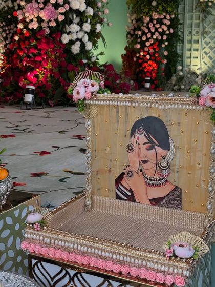 A custom-made, hand-painted tray used for presenting gifts or offerings during a ceremony.