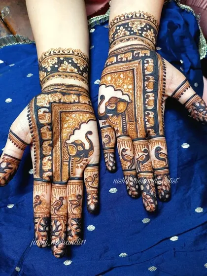 This unique design features prominent elephant motifs on the palms, framed by intricate borders, symbolizing strength and good fortune for the new beginning.