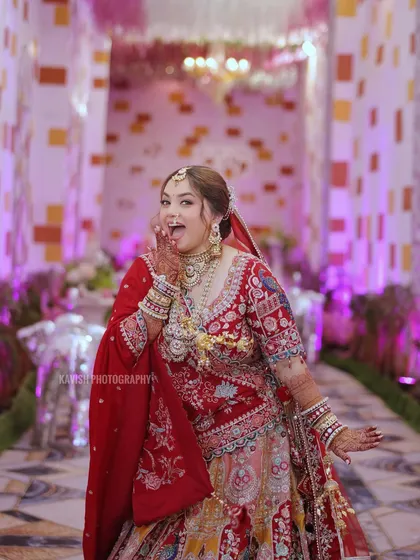 Capturing the bride's fun and playful personality in a candid moment during the wedding festivities. It's these real expressions that tell the true story of your day.