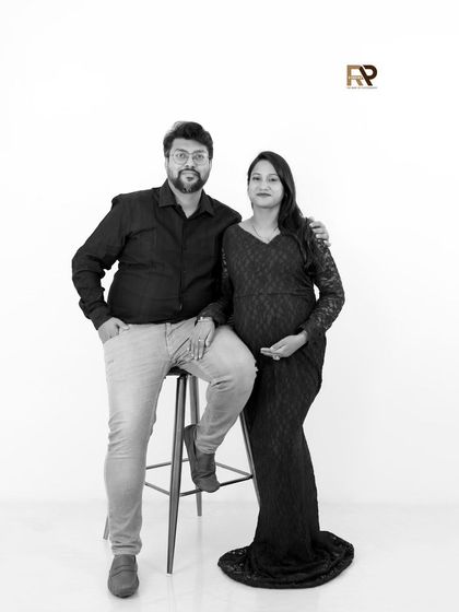 A timeless black and white version of a modern maternity portrait. The lack of color emphasizes the form, expression, and connection between the couple.