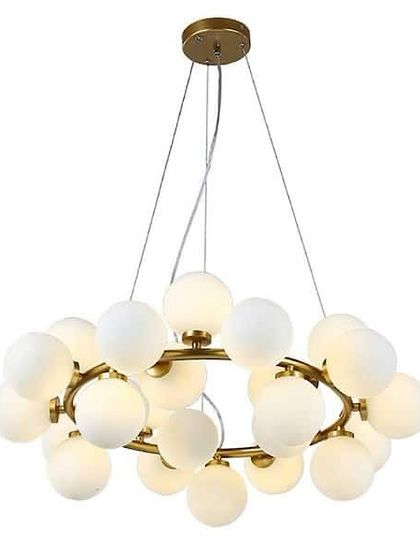 A beautiful chandelier with a cloud of frosted white globes on a gold ring, perfect for a living or dining room.