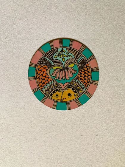 A beautiful Madhubani design painted on a coaster. We encourage students to explore how these ancient motifs can adorn everyday objects, adding a touch of royal elegance to their homes.