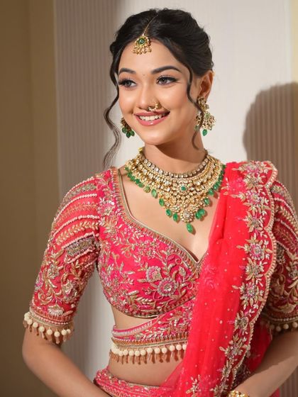 Another beautiful, smiling portrait. The makeup enhances her natural features, making her look effortlessly beautiful and radiant.