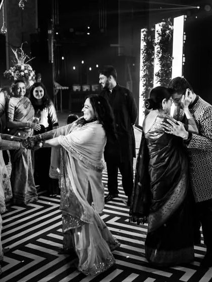 The dance floor comes alive with family. This candid shot captures the joy of different generations celebrating together, a beautiful moment of unity and happiness.