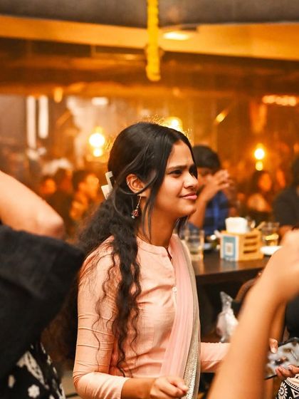A guest in traditional attire enjoying the Diwali party at Flo.