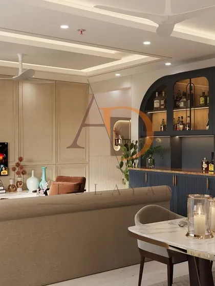An open-concept living and dining area where the custom bar unit serves as a stylish divider. The cohesive design ensures a smooth flow between the different zones, making the space feel both integrated and spacious.
