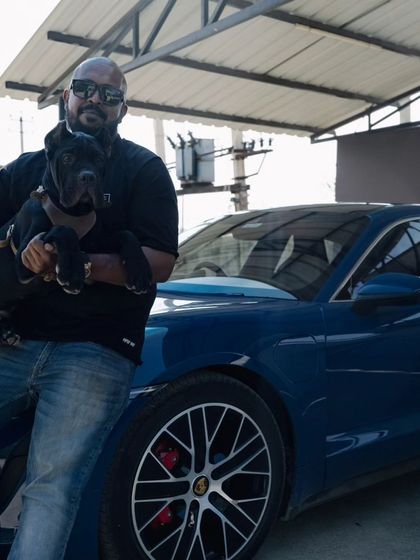 Another shot from the Porsche event. My dog is comfortable and confident enough to be held like this, showing complete trust.