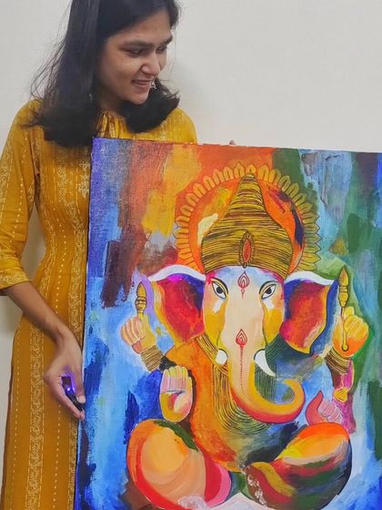 Holding the finished Ganesha painting. It’s always a special feeling to create something that will be a part of someone’s cherished memories and daily life.