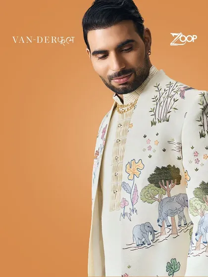 A close-up of the majestic elephant and tree motifs on a Vanderphool sherwani. This design captures a regal and festive vibe, blending traditional elegance with nature's grandeur.