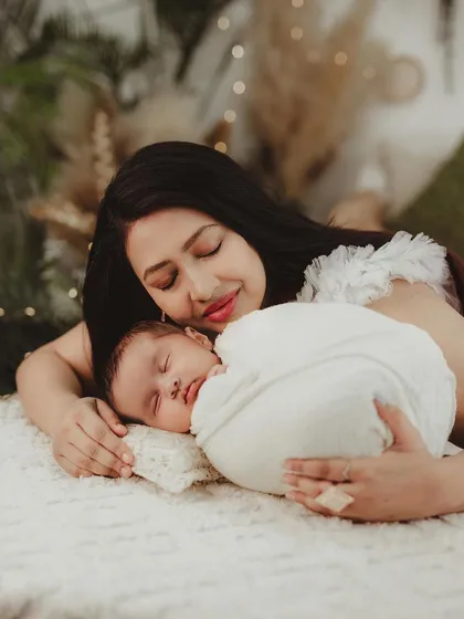 A peaceful moment with mother and baby resting together, showcasing a deep sense of comfort and connection.