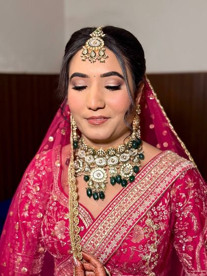 The full look, with the dupatta set. This bride's makeup is understated yet elegant, ensuring she looks like the best version of herself on her wedding day.