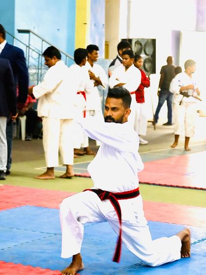 A low stance during my kata routine. This pose demonstrates stability and control, fundamental principles of Budokon karate.
