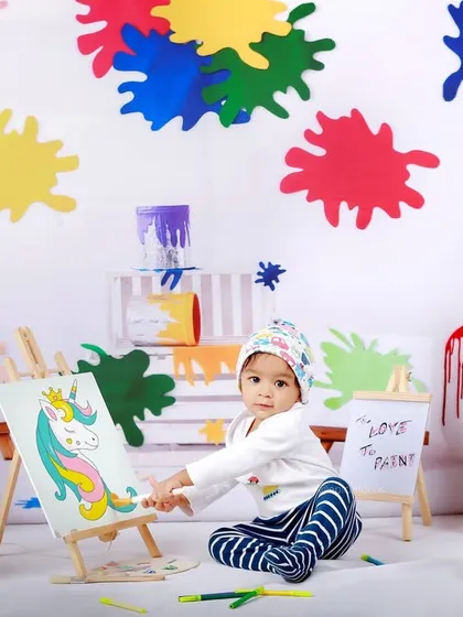 This little artist gets to work on their masterpiece. Our paint-themed set allows for interactive and fun photos that showcase your child's creative side.